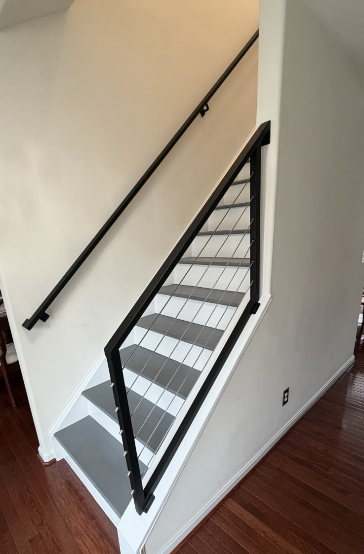 metal stair railing with cables