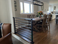 Railing separating kitchen and living room