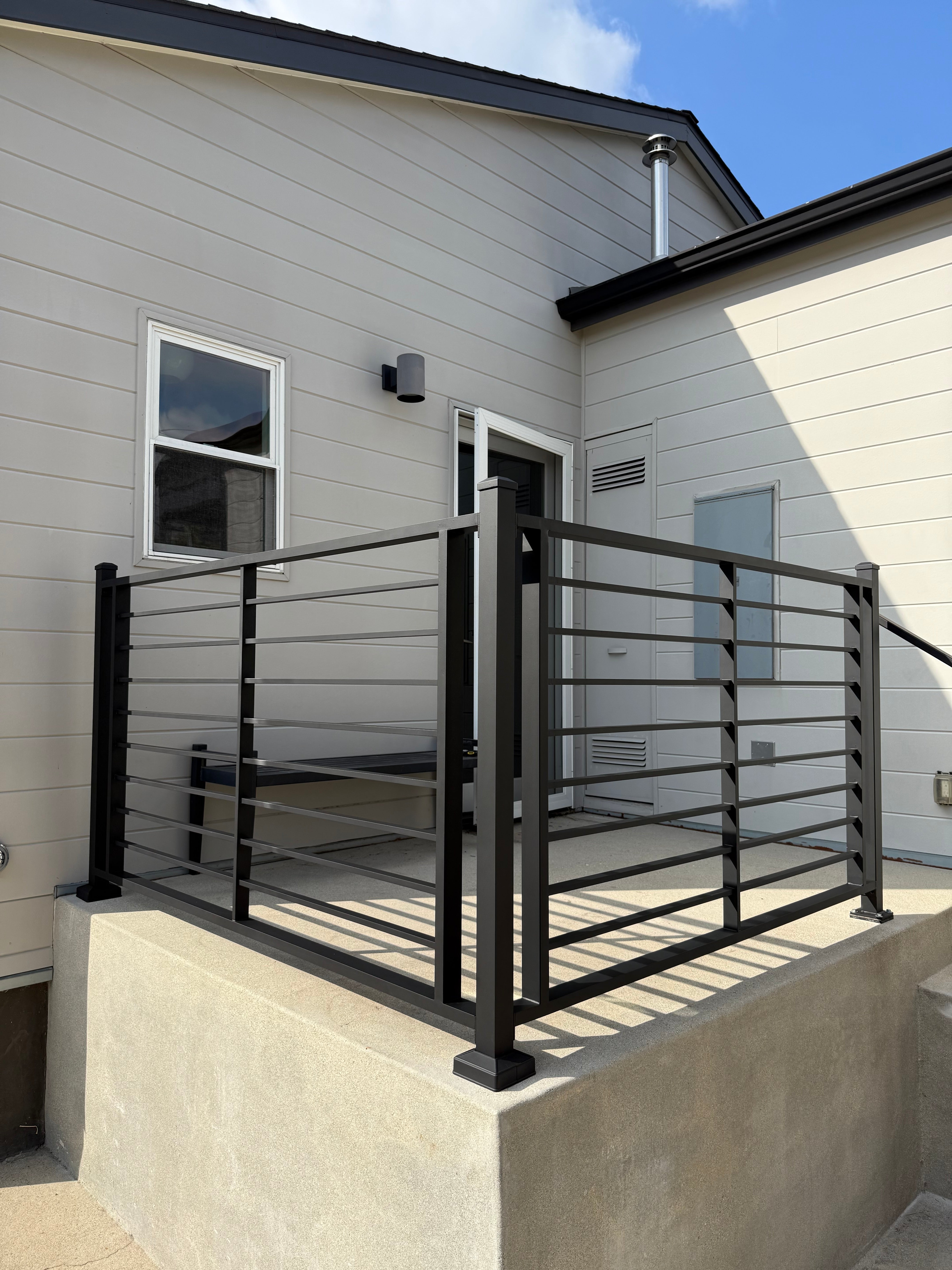 Modern house exterior with a deck and railing